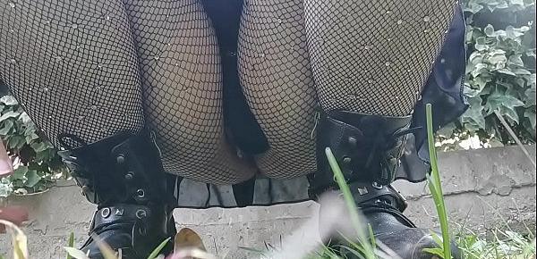  Your mother wants to piss in a public garden so she bends over and shows you her pussy under a pair of fishnet stockings